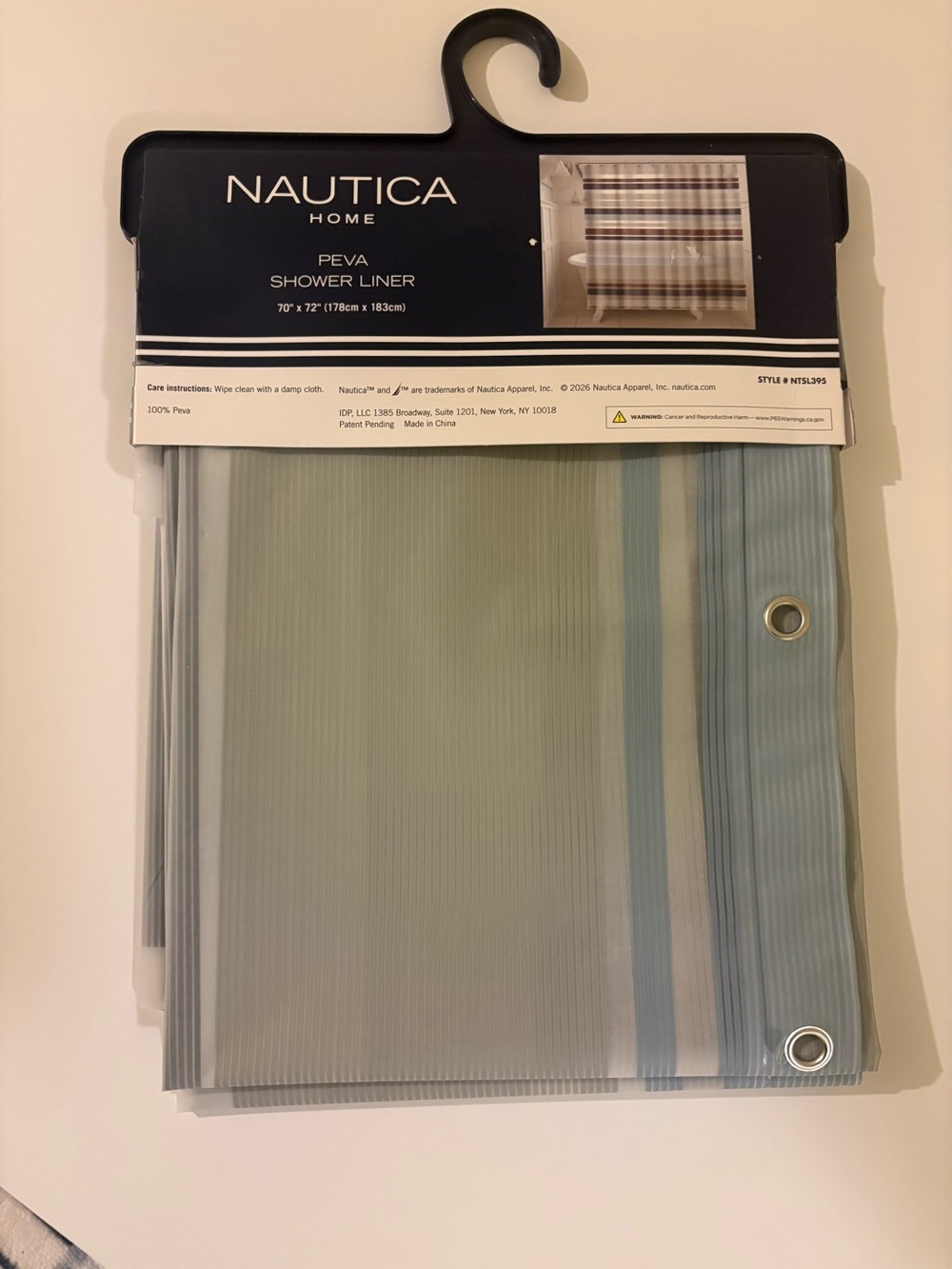 New in package. Nautica Shower Curtain Liner in Light Blue and Gray Stripes